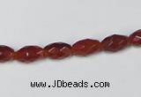 CAA124 15.5 inches 6*10mm faceted rice red agate gemstone beads